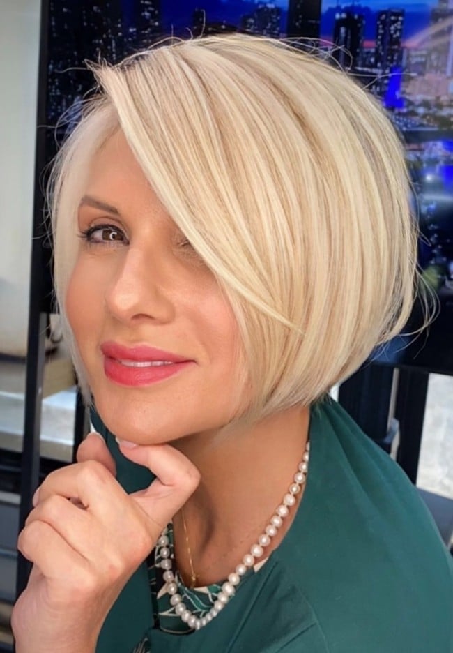 Chin Ash Blonde Bob With Side Swept Bangs — Blonde Hair Colors