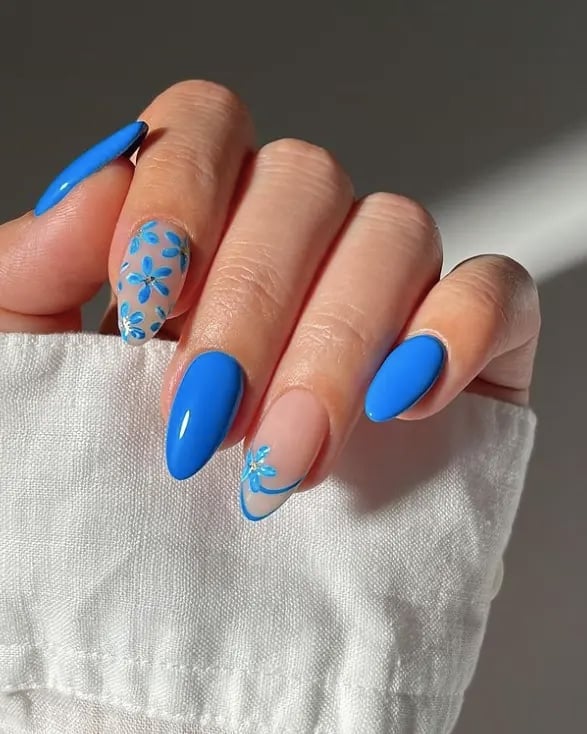 Bright Blue Almond Nails with Light Blue Floral Art — Blue Nails