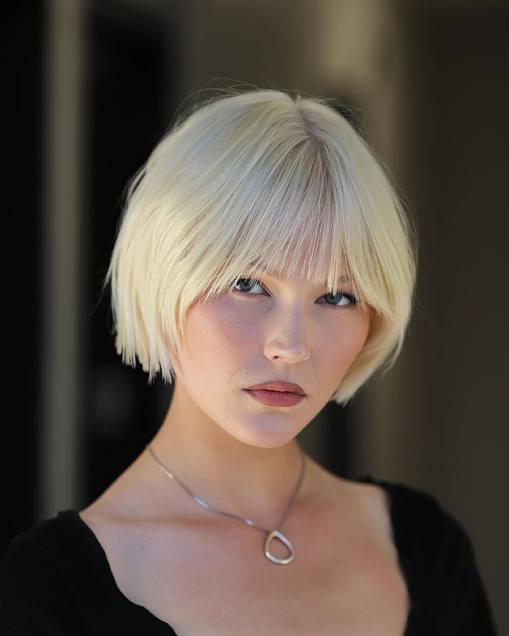 Platinum Blonde Jaw Length Bob With Curtain Bangs, Close-Up Take Platinum Blonde Jaw Length Bob With Curtain Bangs, Close-Up Take — Blunt Bob