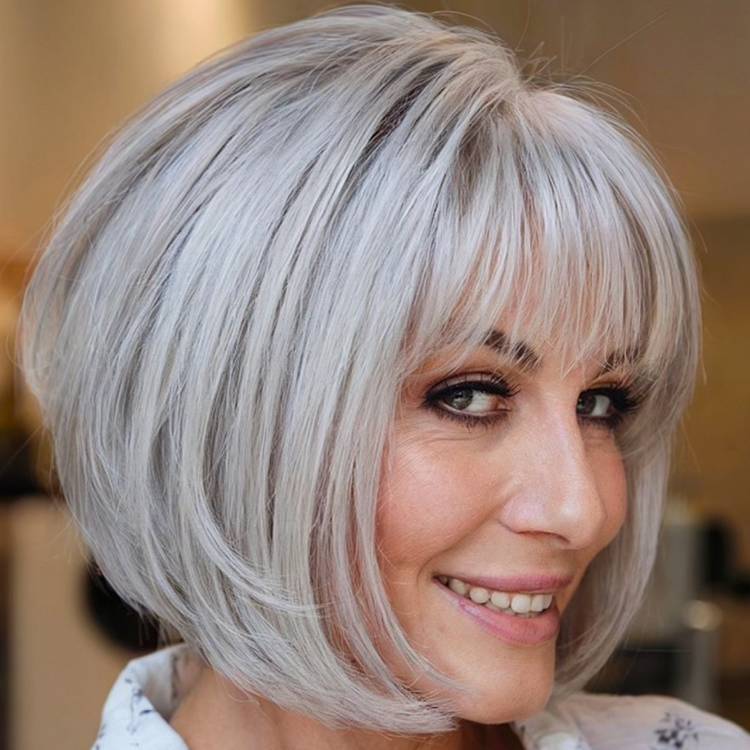 Sleek Chin Bob With Stacked Layers And Bangs — Bob for Women Over 50