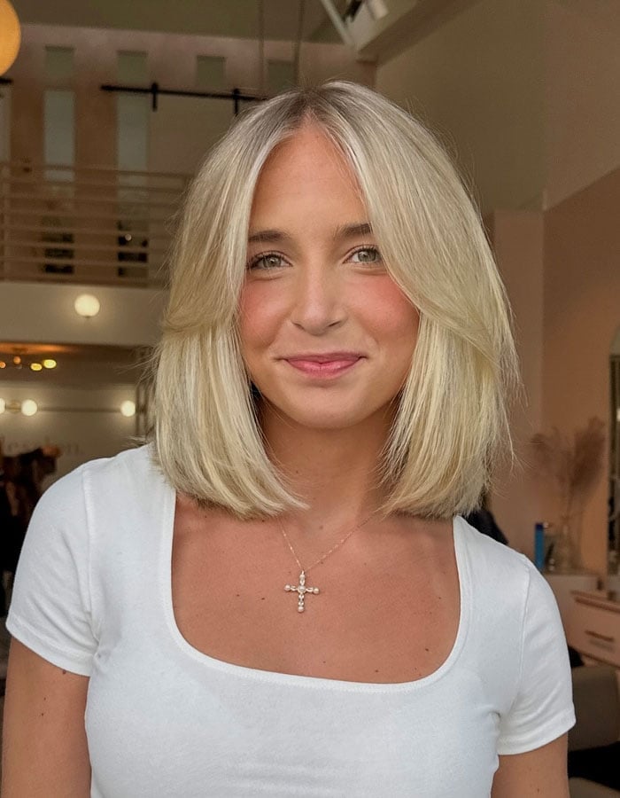 Sleek Platinum Blonde Bob With Curtain Bangs