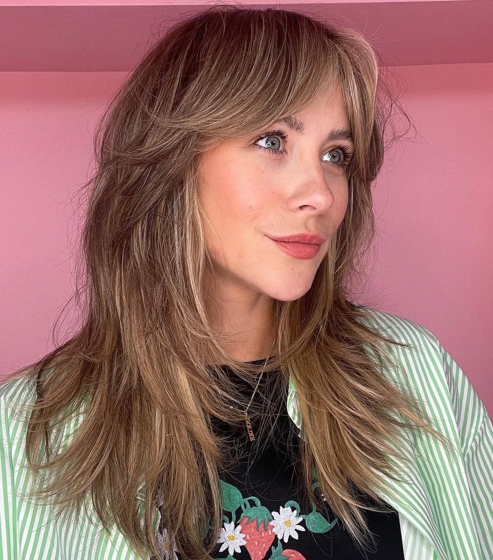 Honey Blonde Shag With Choppy Layers And Curtain Bangs Honey Blonde Shag With Choppy Layers And Curtain Bangs