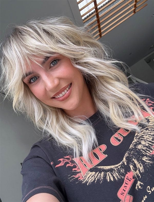 Platinum Blonde Shag With Choppy Layers And Dark Roots Platinum Blonde Shag With Choppy Layers And Dark Roots