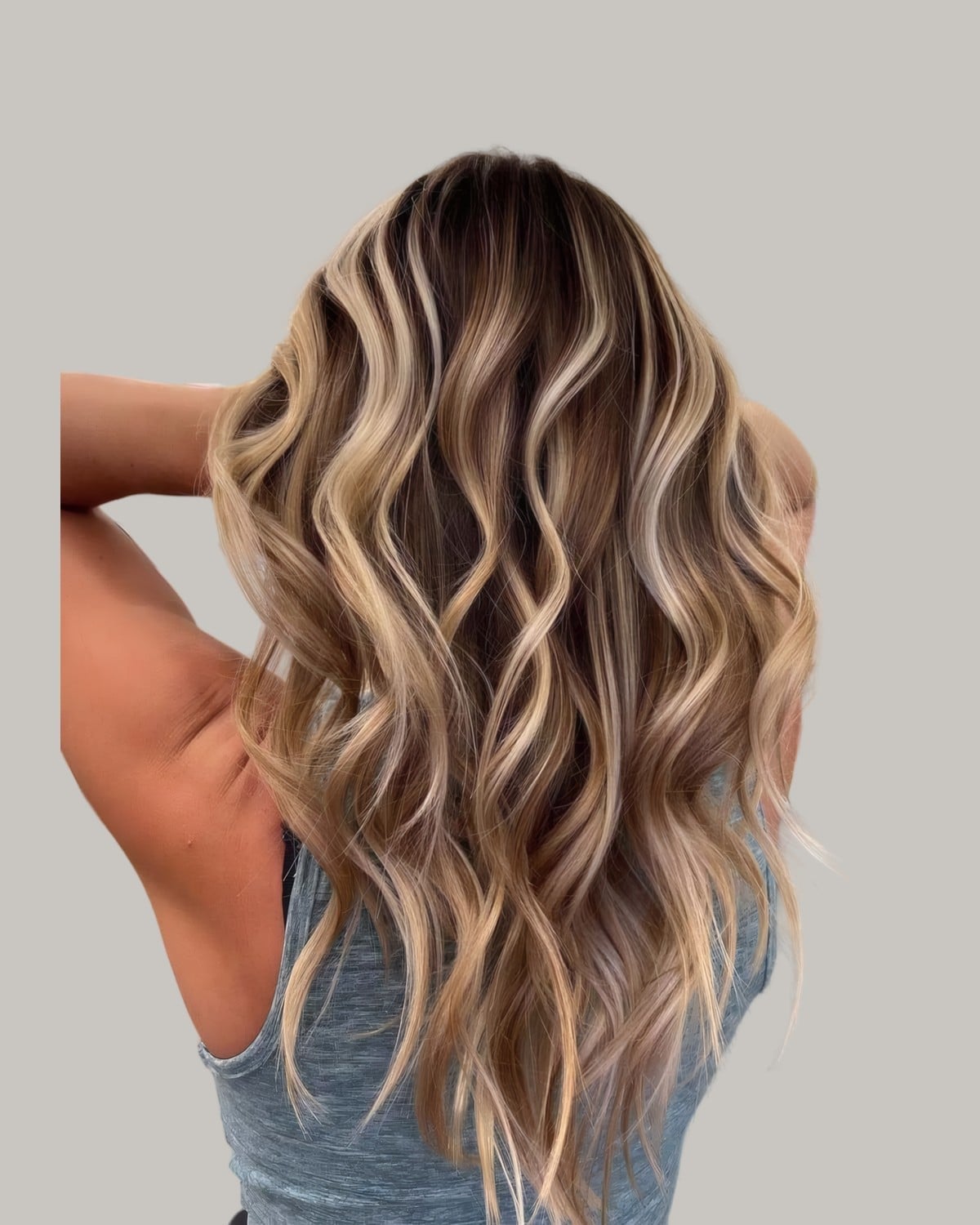 Mid-Back Wavy With Bold Blonde Chunky Highlights, A Dark Mid-Back Wavy With Bold Blonde Chunky Highlights, A Dark