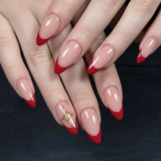 Bold Red French Gold Star Charm Almond Nails Bold Red French Gold Star Charm Almond Nails — Concert Nails