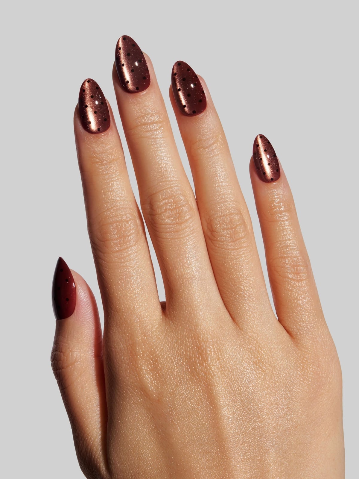 Medium Almond Red-Brown Copper Cat Eye with Dots, Close-Up Take — Copper Nails