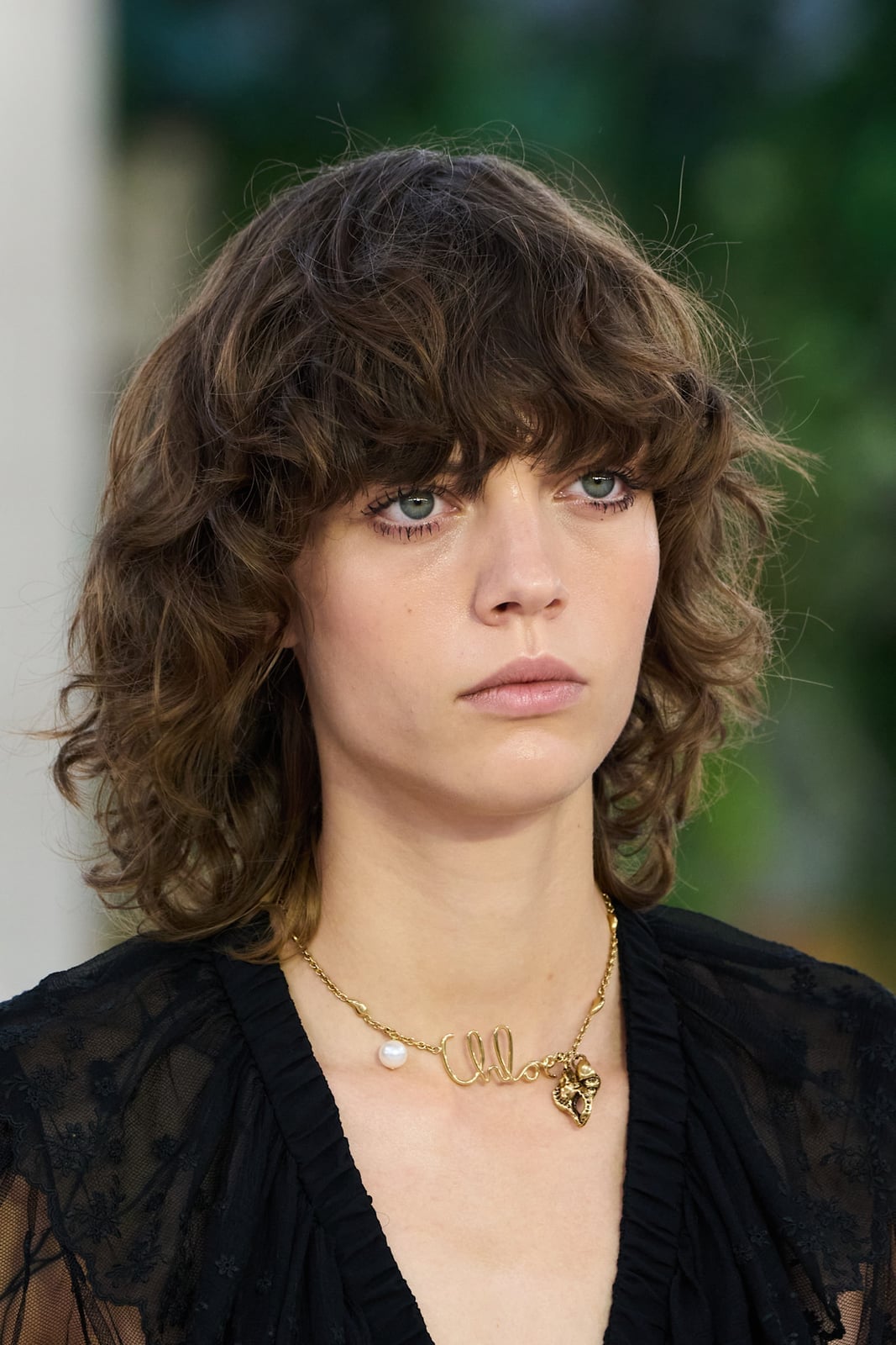 Chin Length Dark Brown Curly Bob Curtain Bangs, Close-Up Take Chin Length Dark Brown Curly Bob Curtain Bangs, Close-Up Take