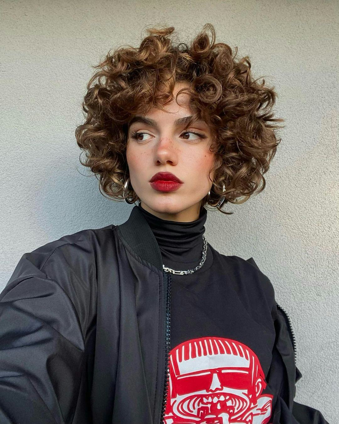 Short Ear Length Curly Bob With Textured Bangs Short Ear Length Curly Bob With Textured Bangs