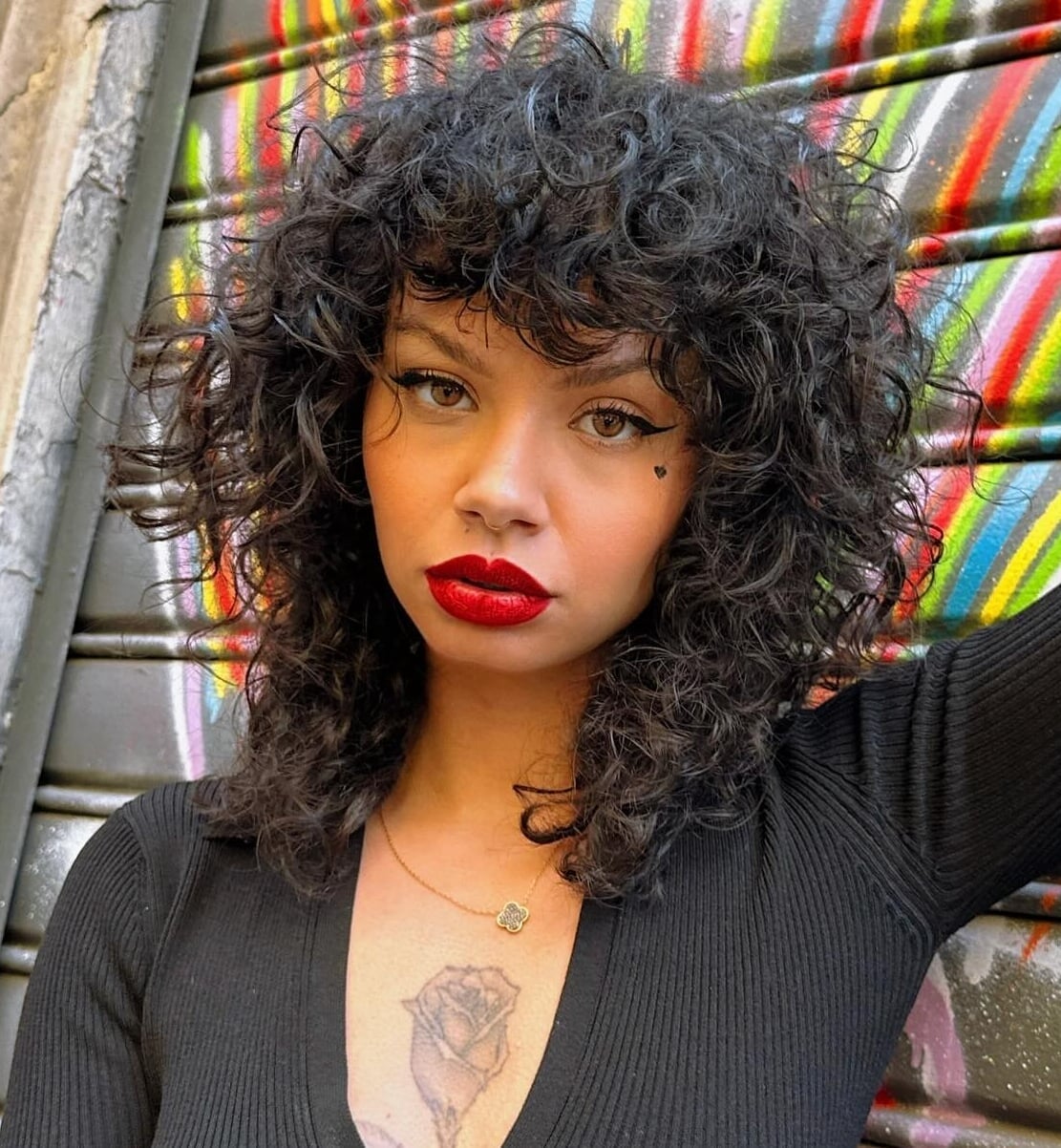 Black Collarbone Curly Shag With Wispy Bangs Black Collarbone Curly Shag With Wispy Bangs