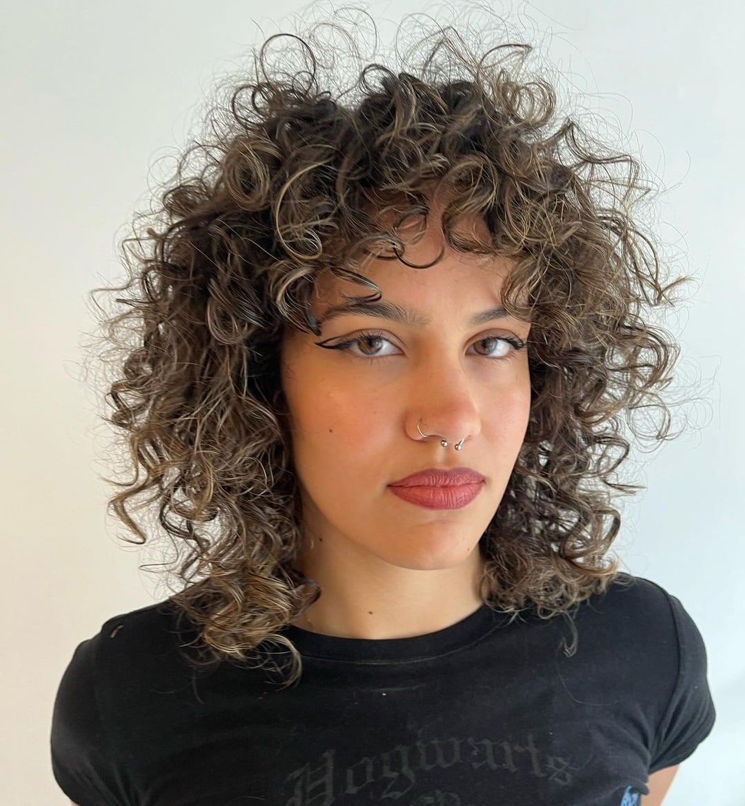 Collarbone Wolf Cut With Voluminous Short Bangs — Curly Wolf Cut