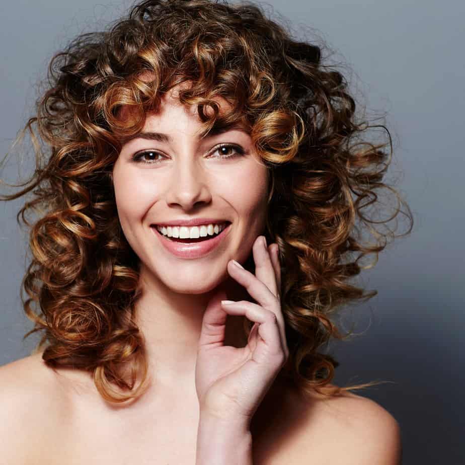 Mid-Back Curly Wolf Cut With Wispy Bangs