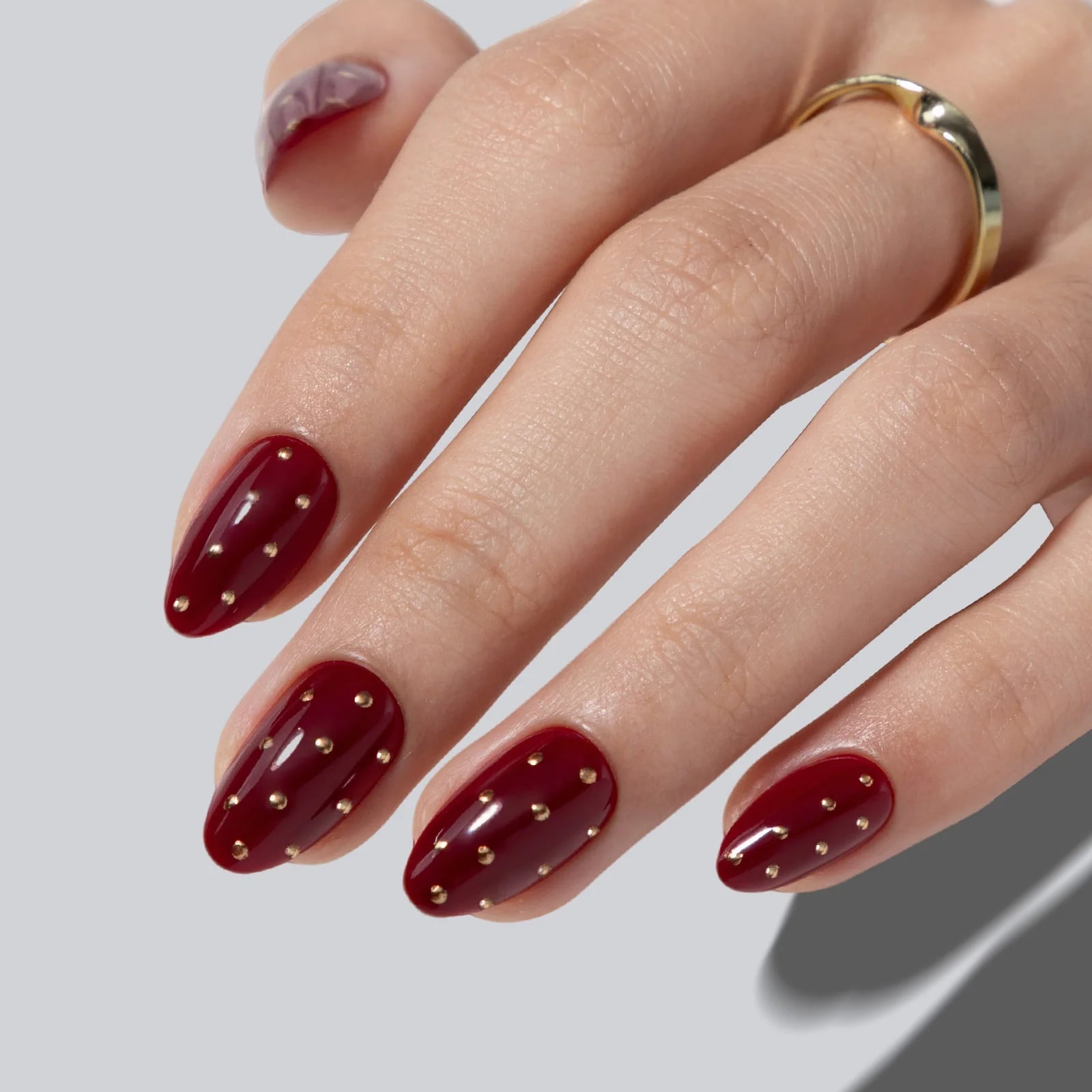 Short Almond Dark Red With Gold Studs — Dark Red Nails