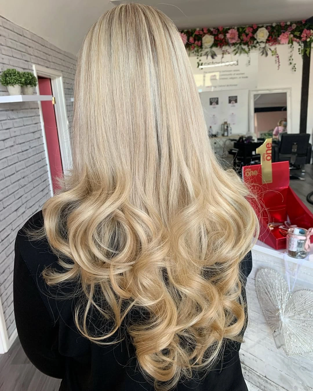 Long creamy blonde hair with smooth upper lengths and curled ends