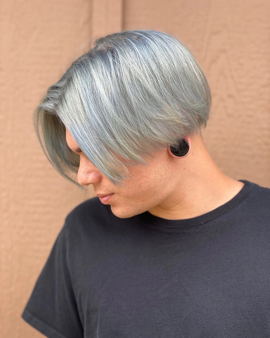 Short silver hair with long side swept fringe and cropped sides