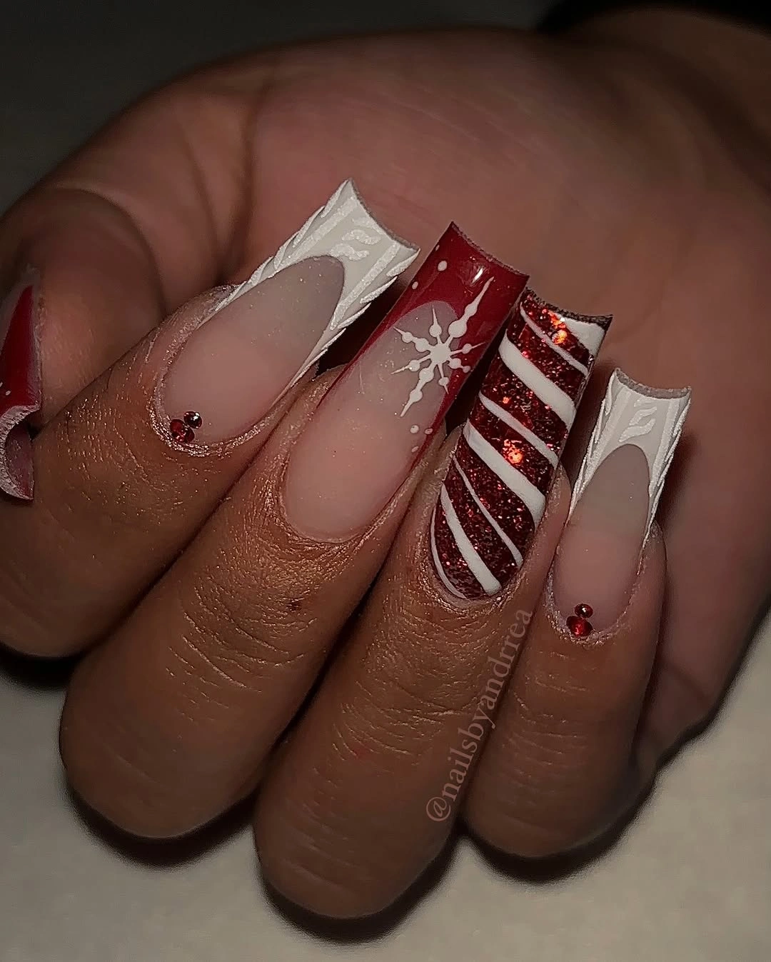 Long flared square nails with red glitter white edges and snowflake
