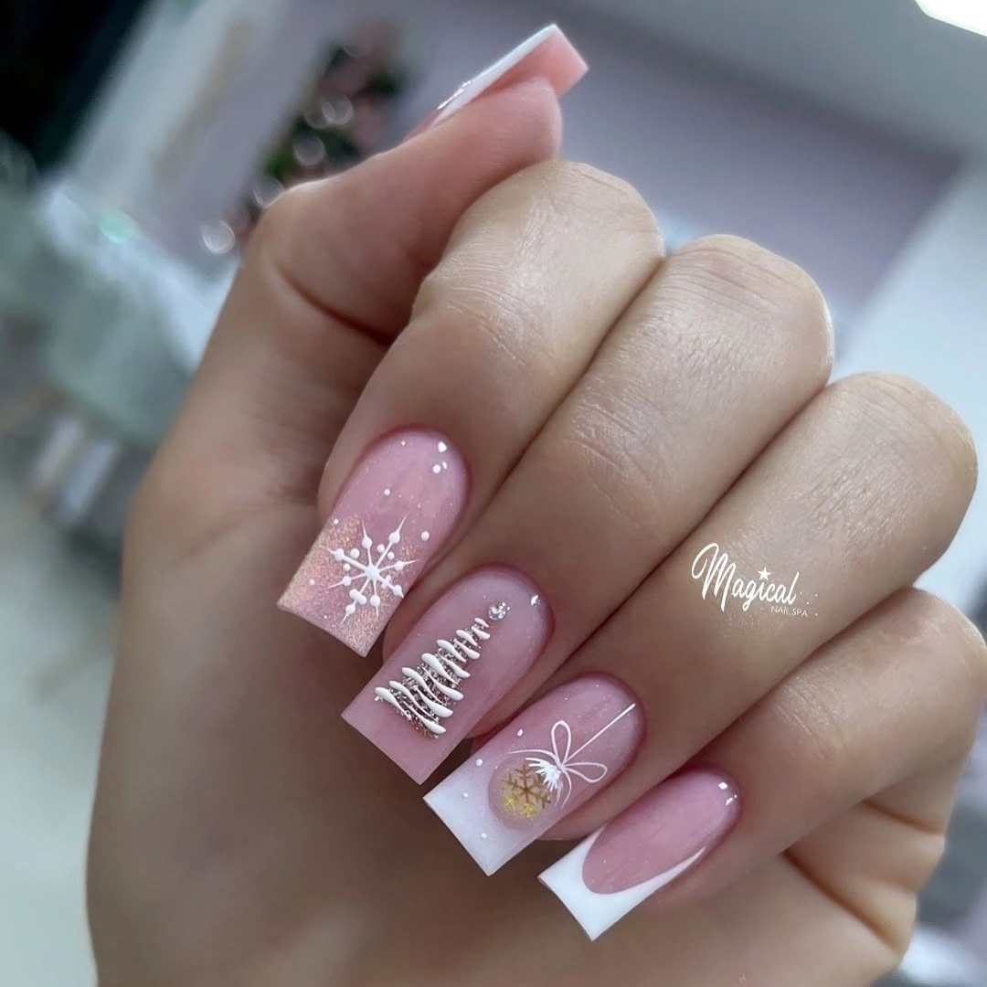 Square blush pink nails with white French tips snowflakes and silver tree decoration