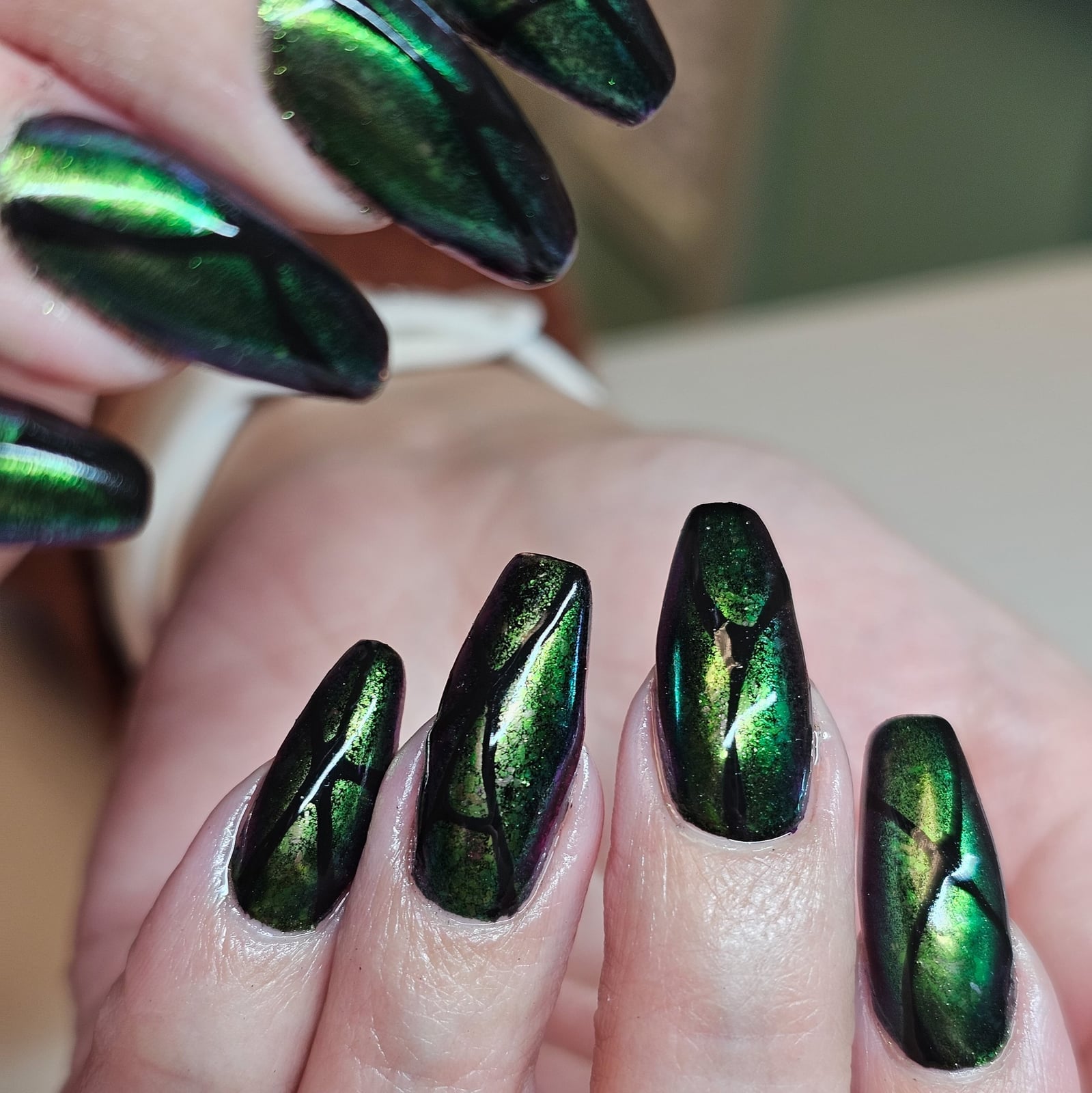 Deep Green Chrome Abstract Lines Medium Almond Nails — Green Chrome Nails