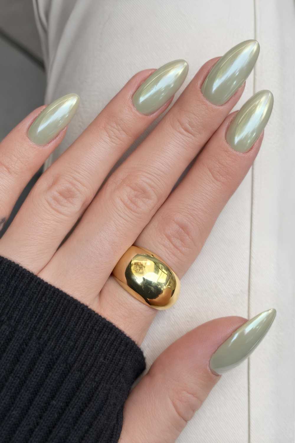 Pale Green Chrome Shimmer Medium Almond Nails, Close-Up Take — Green Chrome Nails