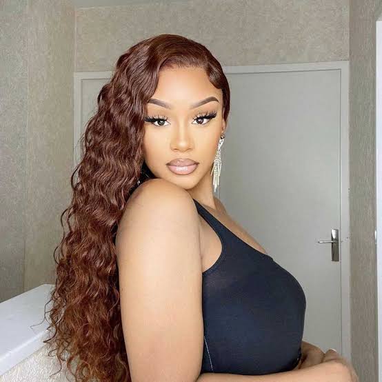 Mid-Back Wavy Medium Brown With Red Undertones — Hair Color for Black Women