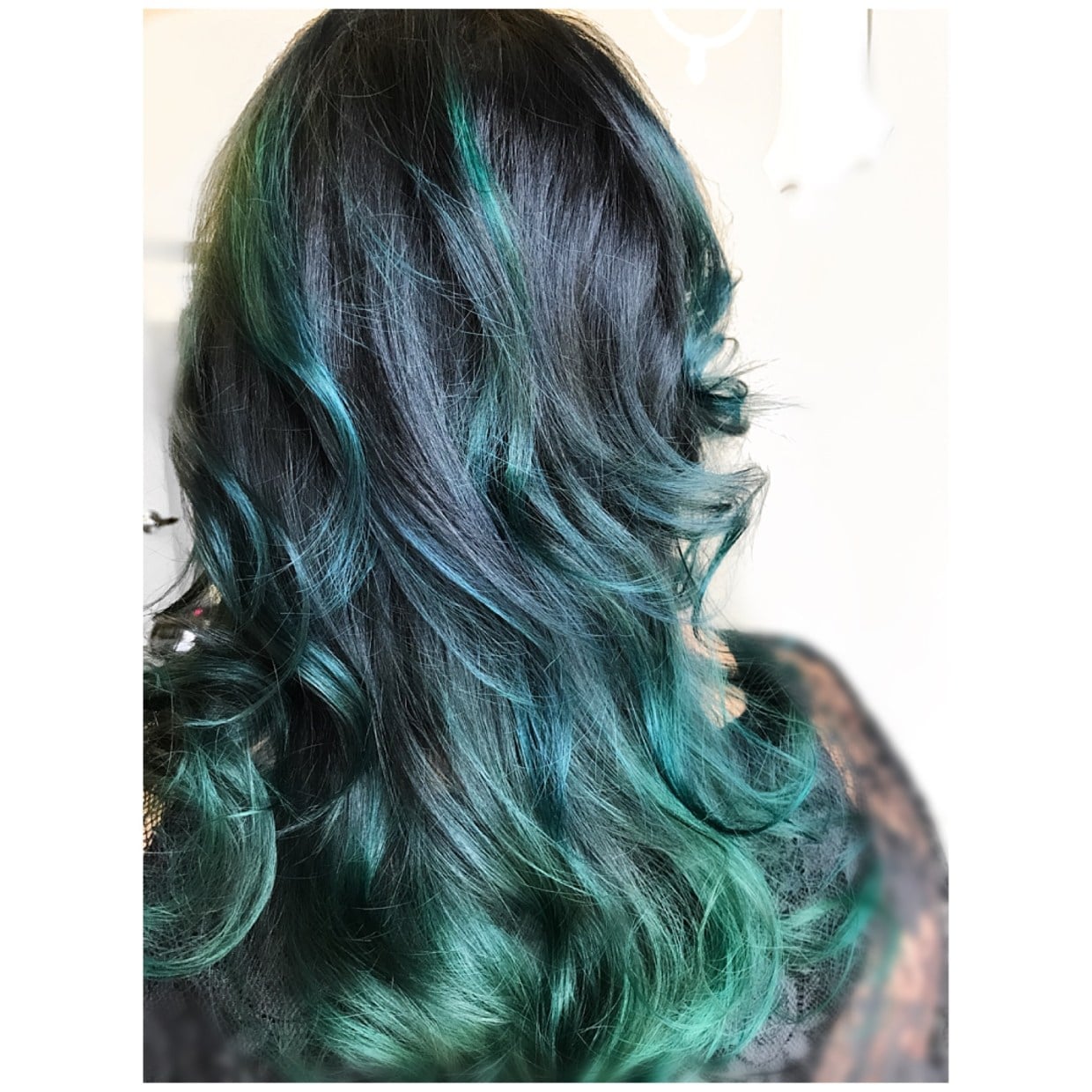 Mid-Back Dark With Teal And Blue Highlights Mid-Back Dark With Teal And Blue Highlights — Hair Color for Women Over 40