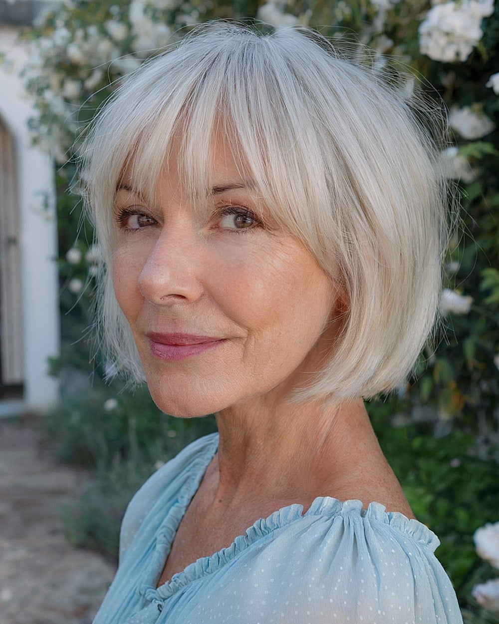 Chin Length Ash Blonde Bob With Curtain Bangs Chin Length Ash Blonde Bob With Curtain Bangs — Haircuts for Women Over 60