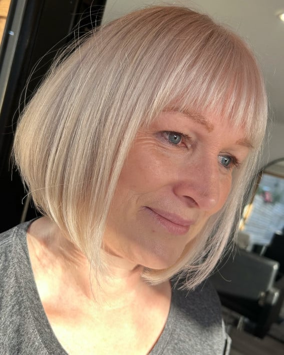 Ash Blonde Chin Bob With Blunt Bangs, Close-Up Take Ash Blonde Chin Bob With Blunt Bangs, Close-Up Take — Haircuts for Women Over 60