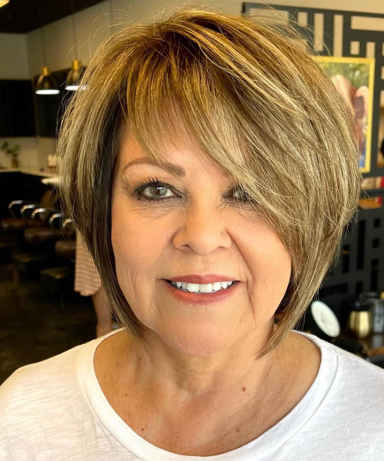 Stacked Bob With Blunt Bangs And Copper Highlights — Haircuts for Women Over 70