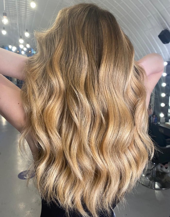 Mid-Back Wavy Blowout With Honey Balayage on Warm Blonde Base
