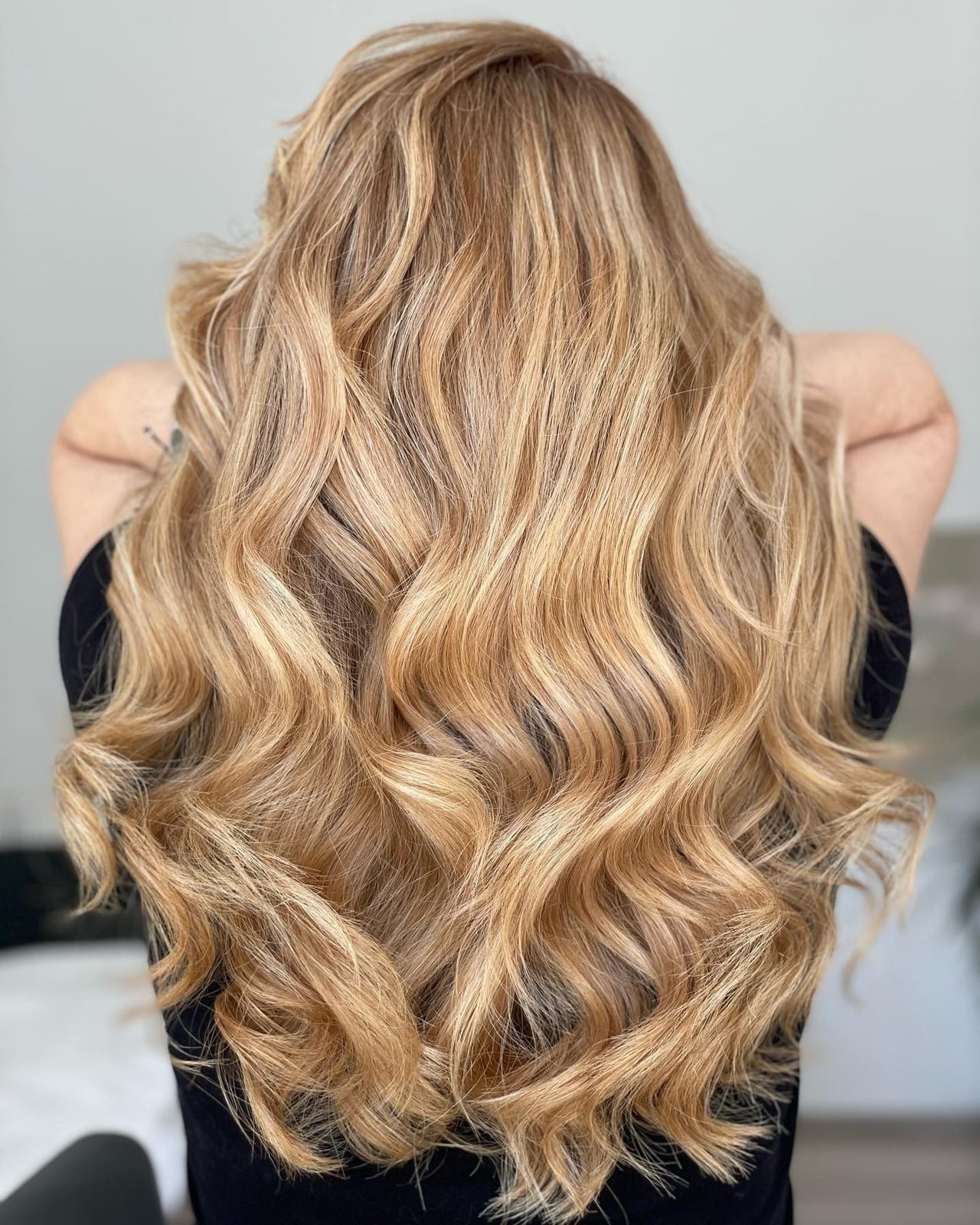 Mid-Back Honey Blonde With Dimensional Color and Curtain Bangs
