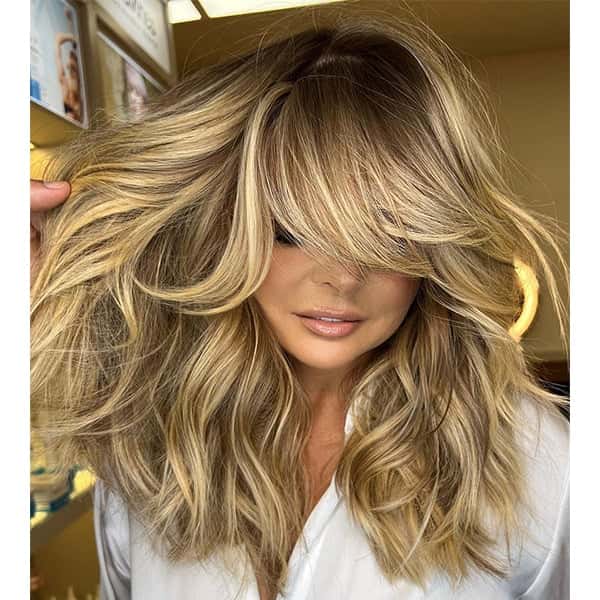 Collarbone Honey Blonde Balayage With Wavy Blowout, Curtain Bangs