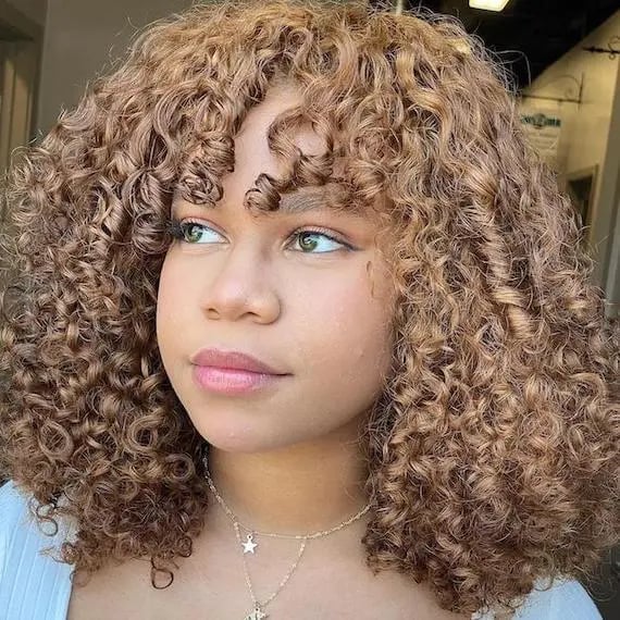 Collarbone Honey Blonde With Highlights and Curtain Bangs