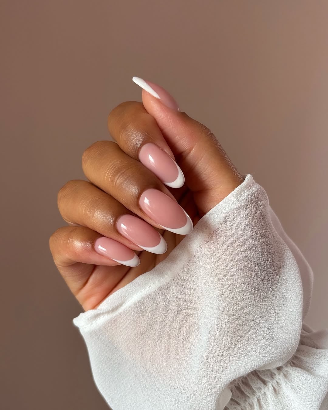 Classic Sheer Pink Medium Almond French, Close-Up Take Classic Sheer Pink Medium Almond French, Close-Up Take — Interview Nails