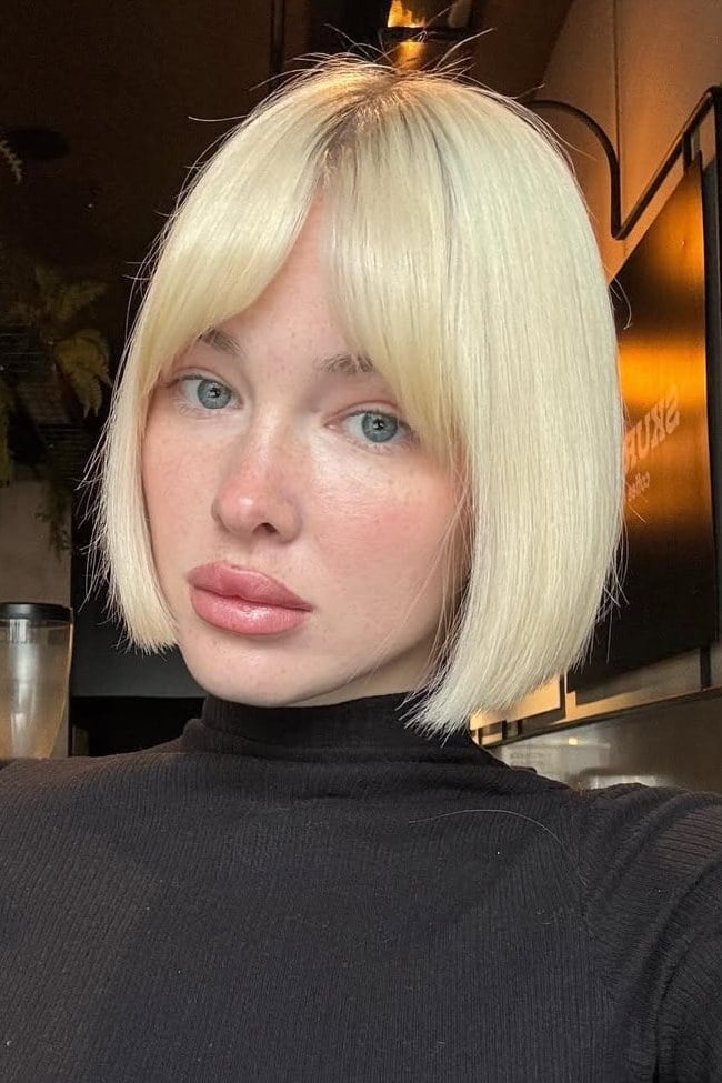 Chin Length Platinum Blonde Blunt Bob Curtain Bangs Chin Length Platinum Blonde Blunt Bob Curtain Bangs — Jaw Length Bob
