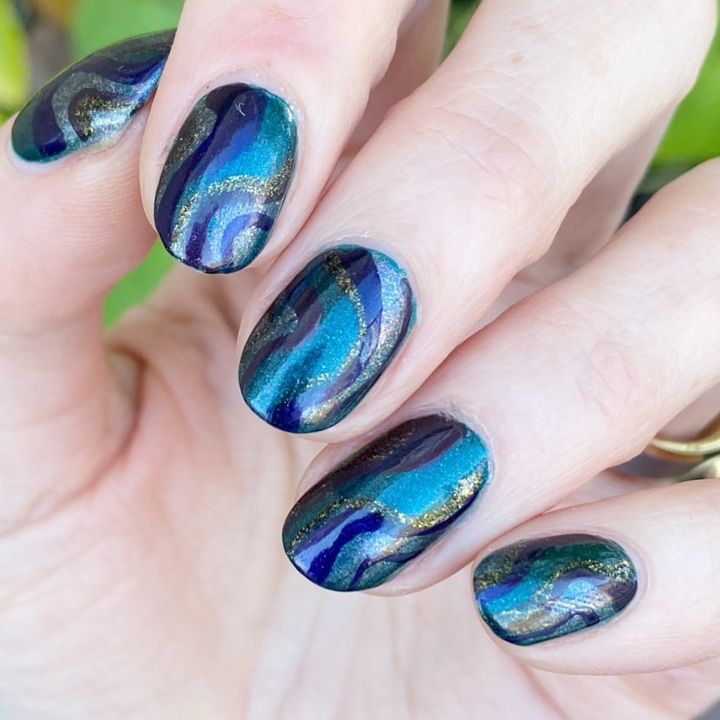 Marbled Deep Blues and Greens with Gold Glitter Short Oval Nails Marbled Deep Blues and Greens with Gold Glitter Short Oval Nails — Jewel Tone Nails