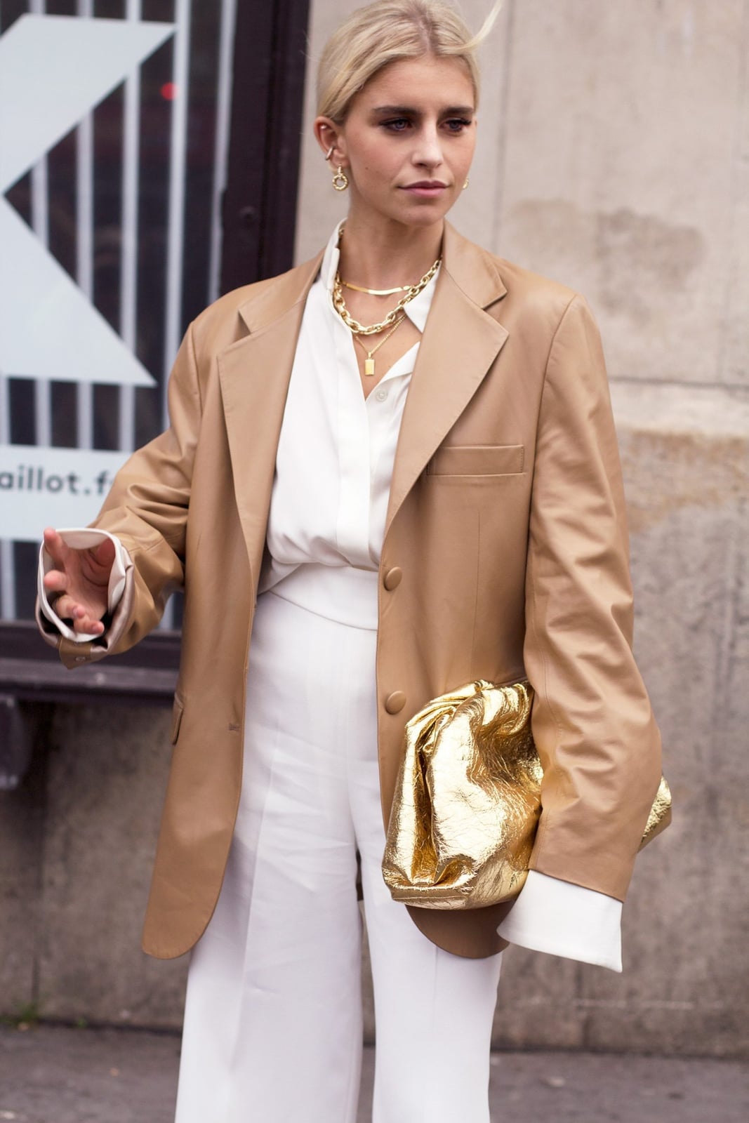 Layered Gold Chains With Oversized Metallic Gold Clutch — Jewelry Trends