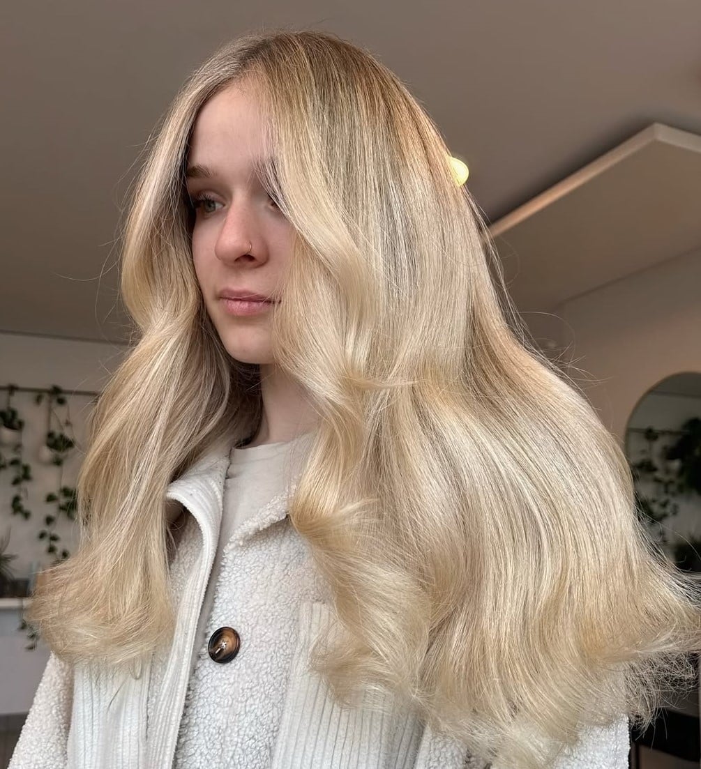 Bright Blonde Mid-Back Layers With Lowlights Bright Blonde Mid-Back Layers With Lowlights — Lived In Blonde