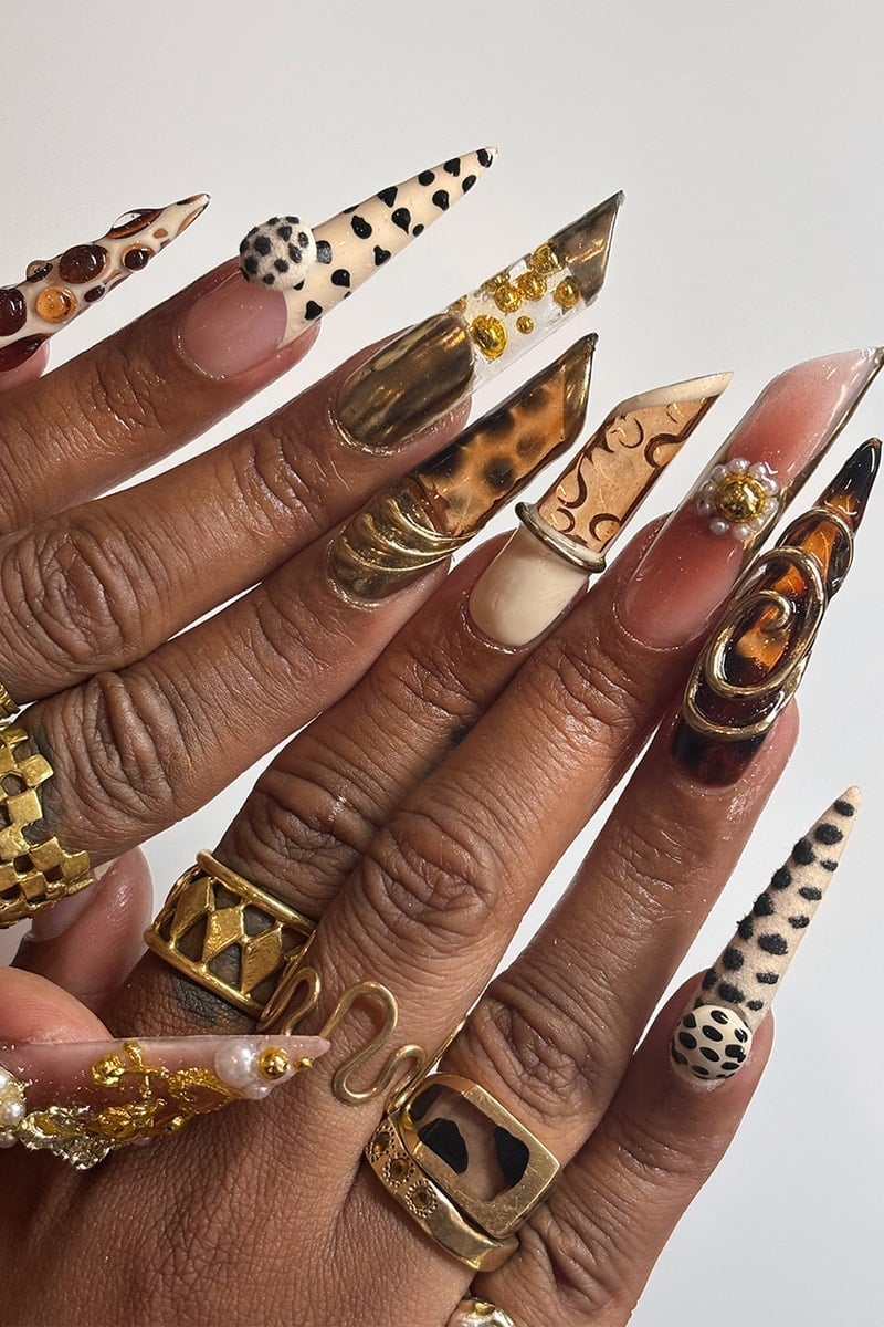 Extreme Stiletto Nails With Mixed 3D Charms And Prints Extreme Stiletto Nails With Mixed 3D Charms And Prints — Long Acrylic Nails