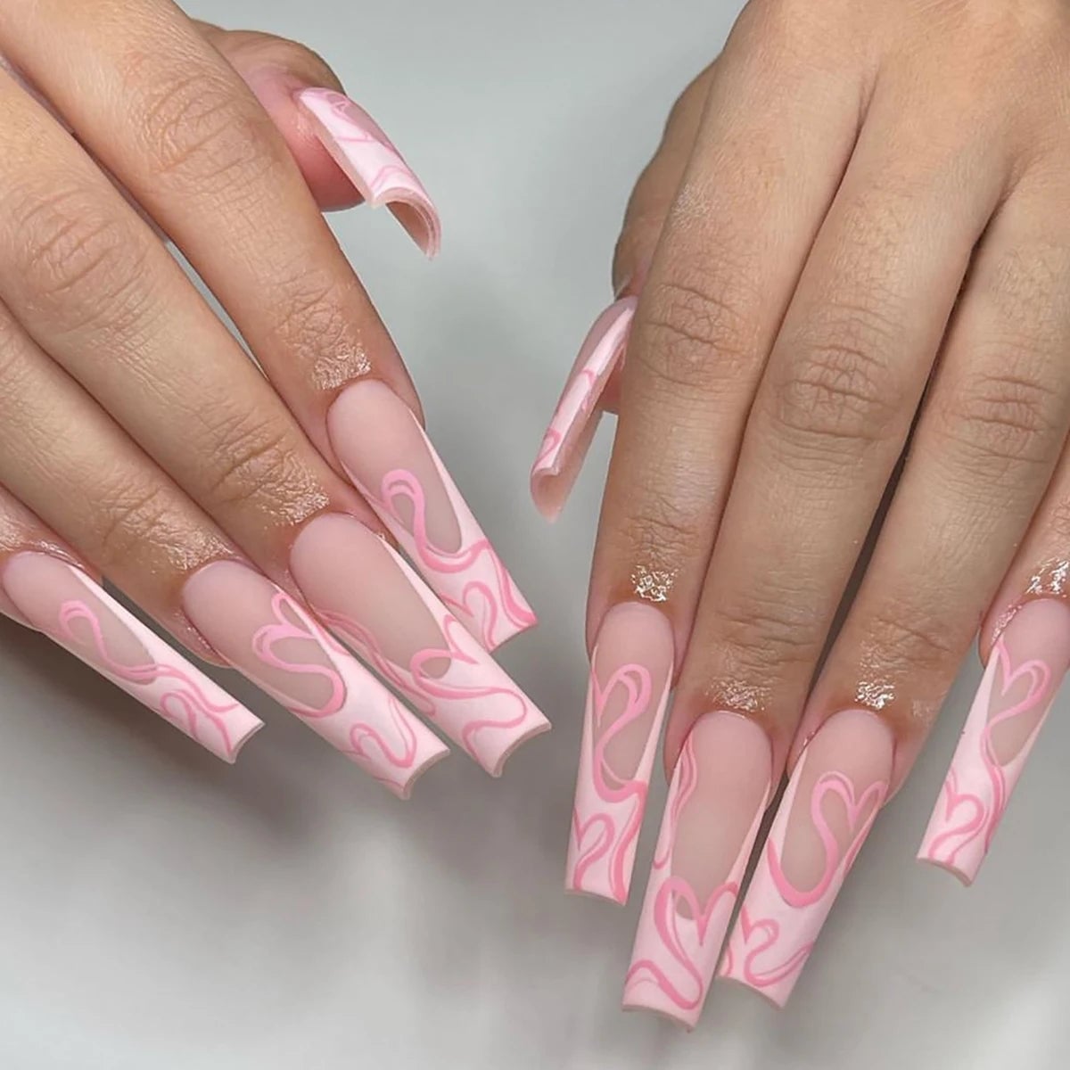 Nude Stilettos With Pink Swirl Designs Nude Stilettos With Pink Swirl Designs — Long Acrylic Nails