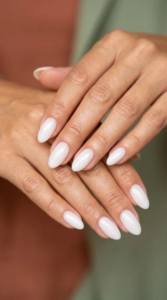 Milky White Glossy Short Almond Nails, Showcasing The Nails Milky White Glossy Short Almond Nails, Showcasing The Nails — Low Maintenance Nails
