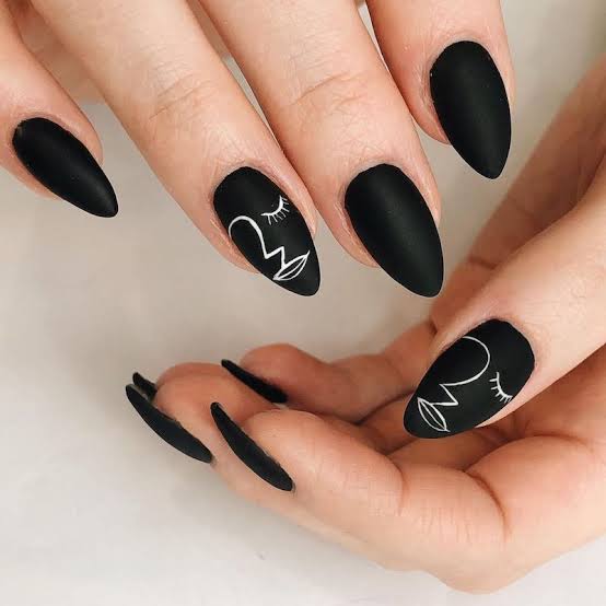 Deep Black Matte Nails with White Abstract Faces