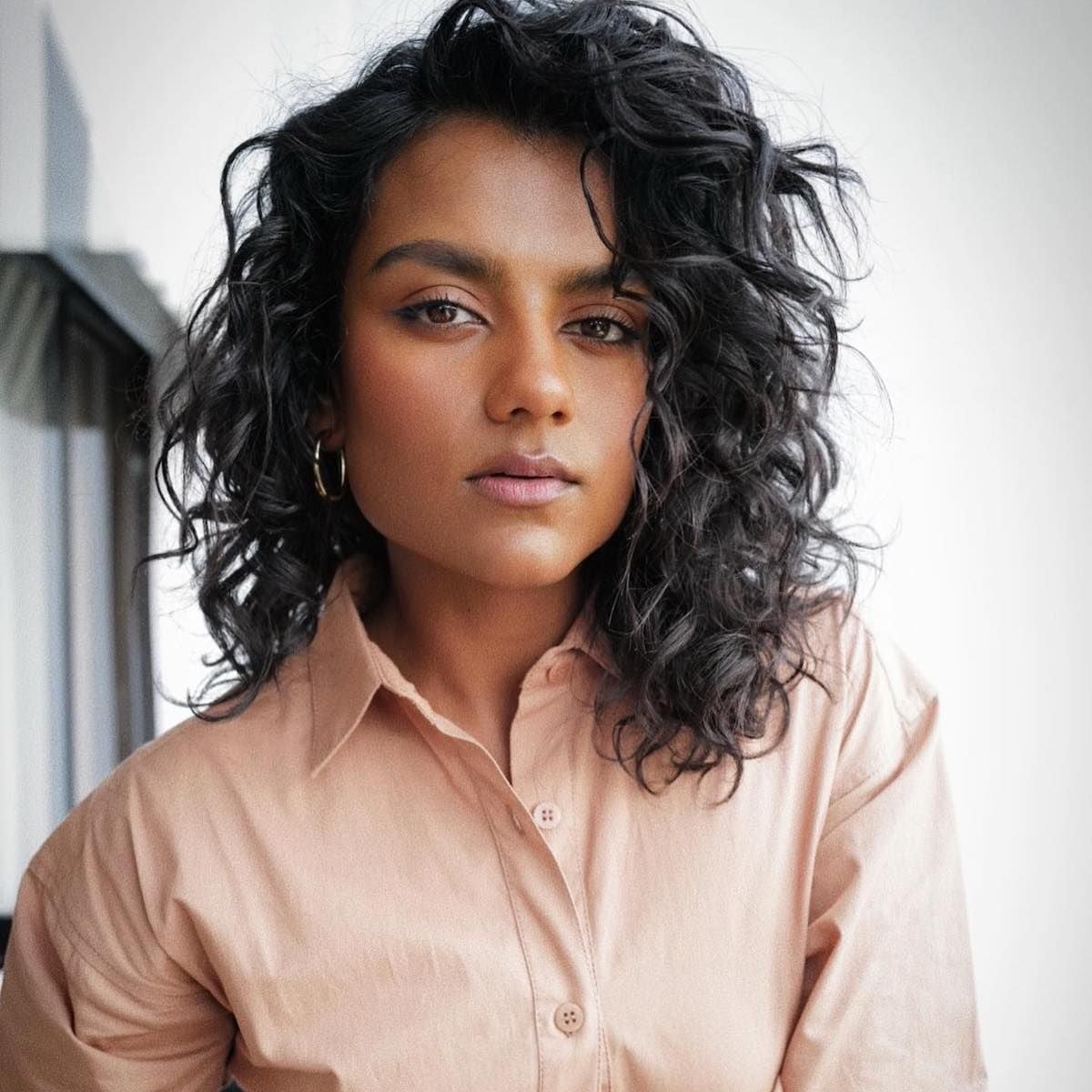 Dark Brown Natural Curls Just Below Shoulder — Medium Haircuts
