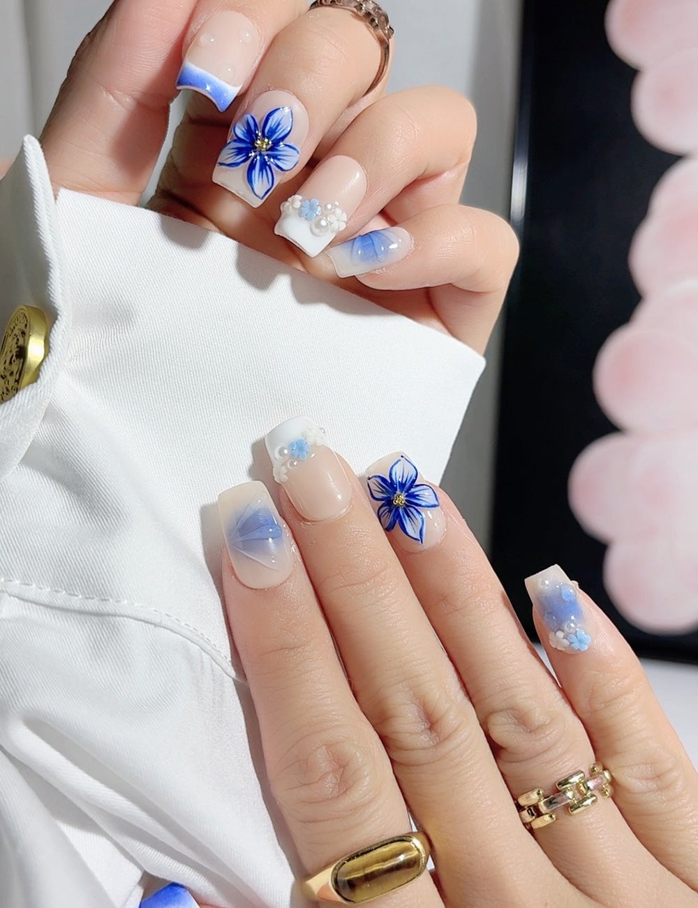 Nude Blue Floral 3D Flower Pearl Medium Square Nails Nude Blue Floral 3D Flower Pearl Medium Square Nails — Medium Nails