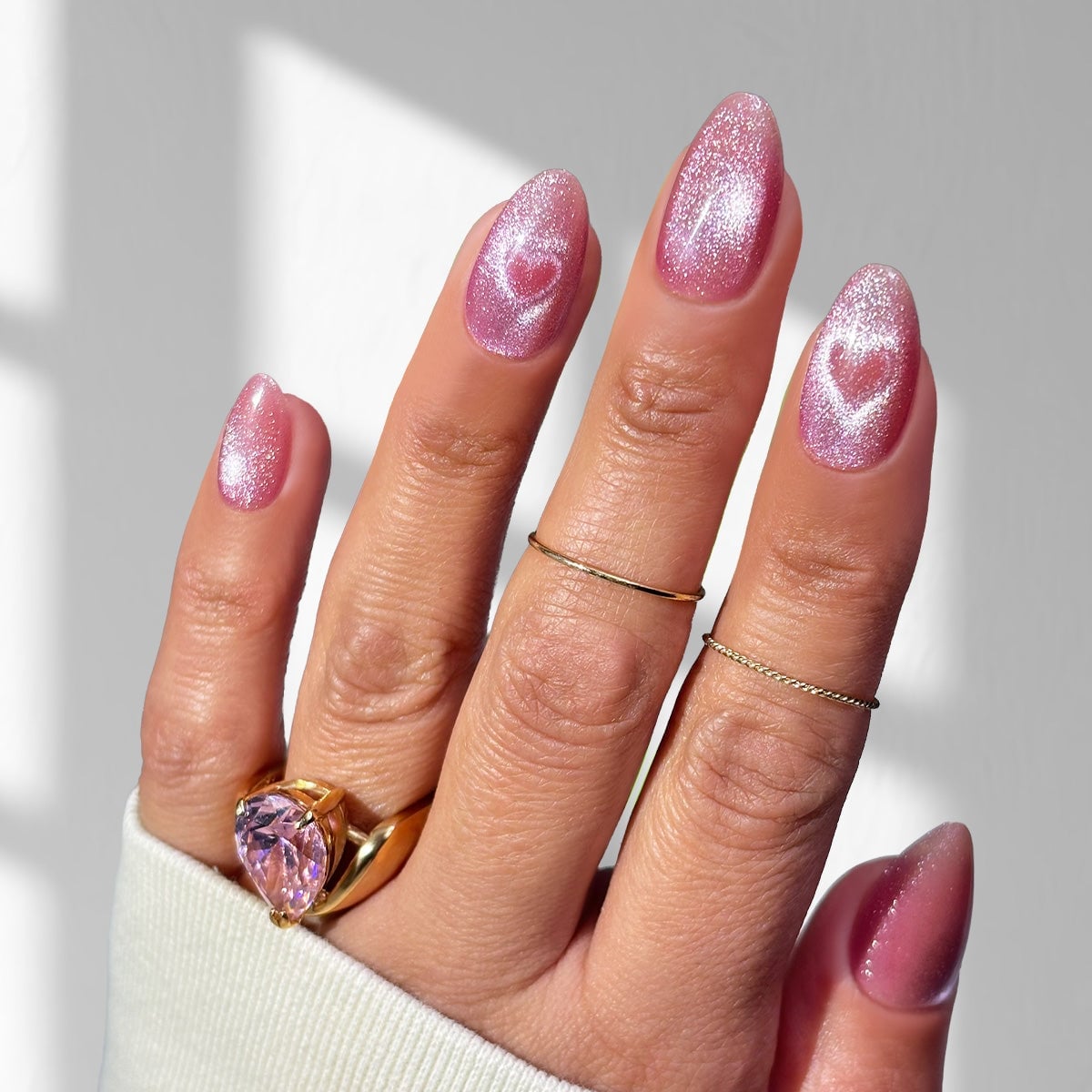 Pink Cat-Eye Medium Almond Nails with Heart Accents Pink Cat-Eye Medium Almond Nails with Heart Accents — Medium Nails