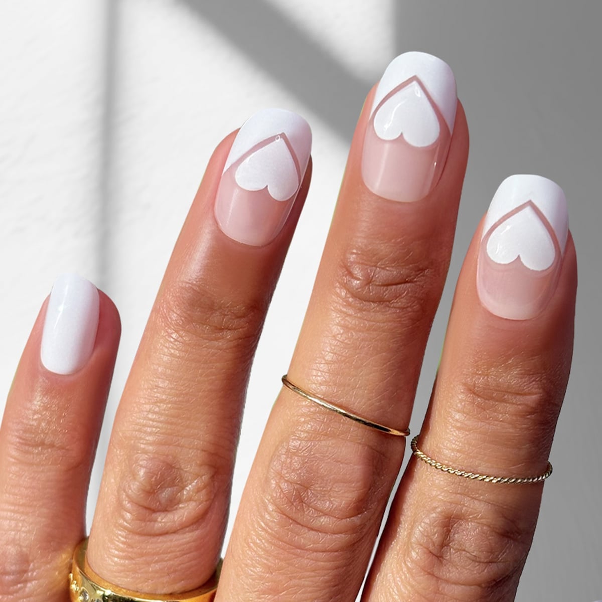 Sheer Pink Heart Outline French Tip Medium Oval Nails Sheer Pink Heart Outline French Tip Medium Oval Nails — Medium Nails