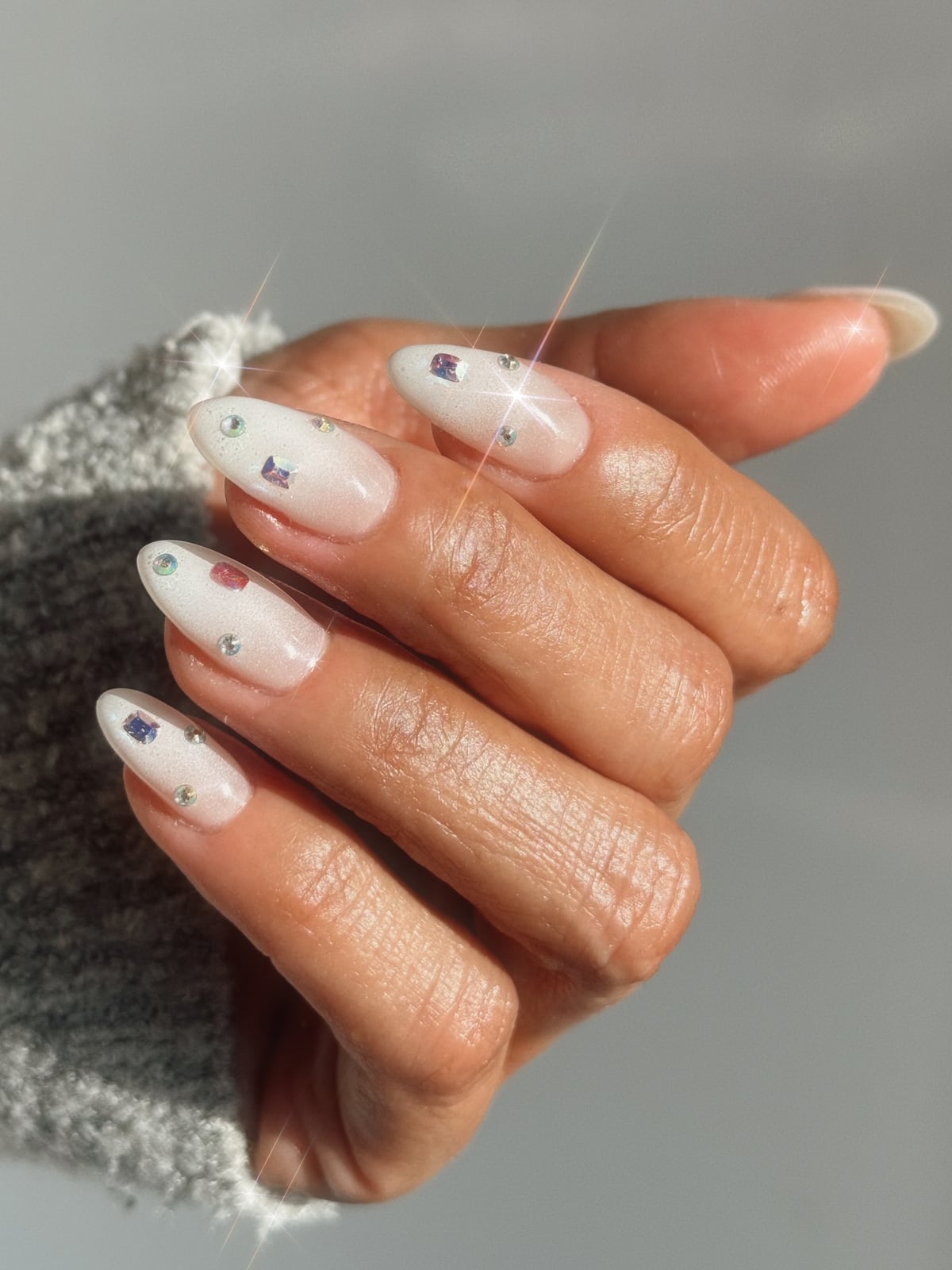 Milky White Rhinestone Charm Medium Almond Nails — Milky Nails