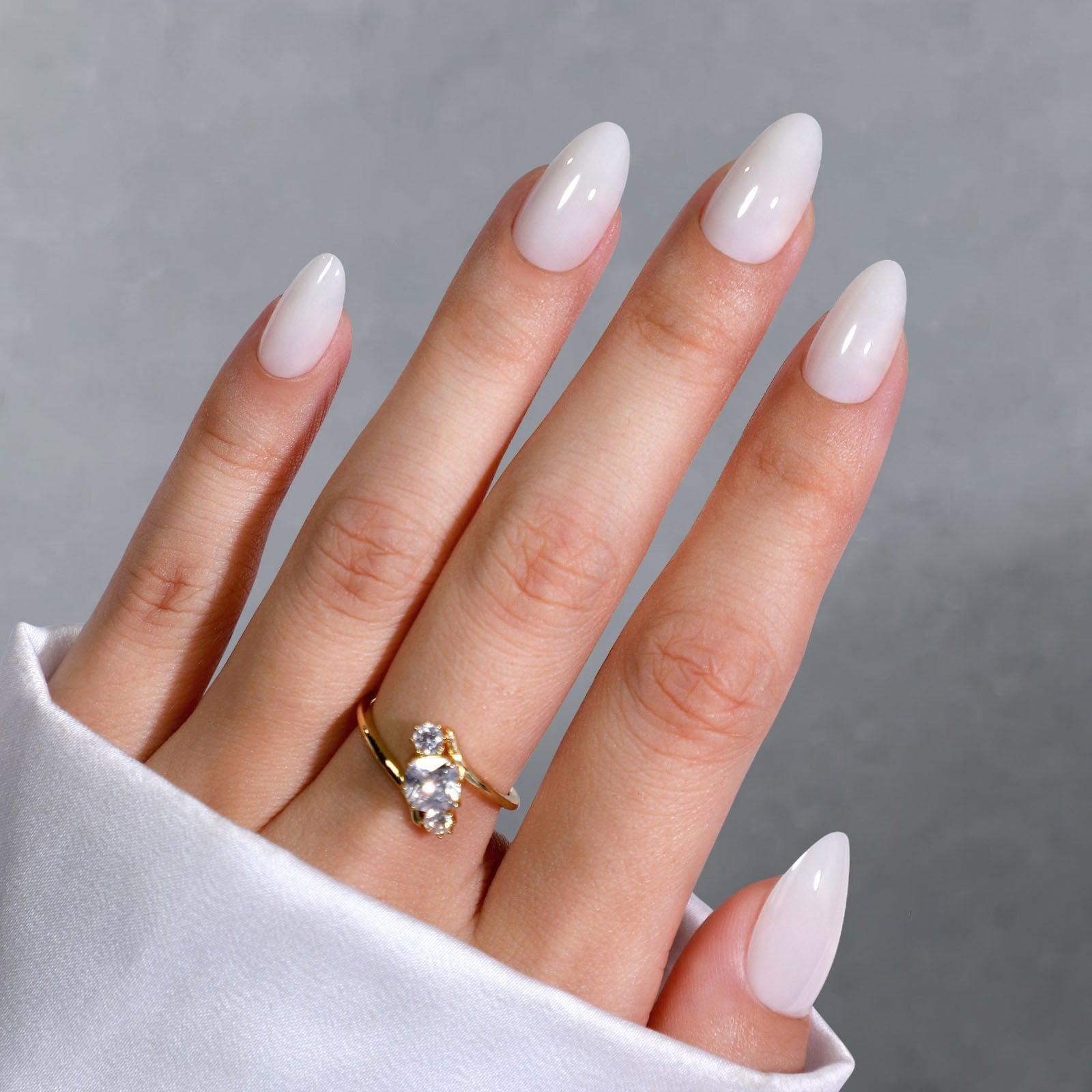 Opaque Milky White Short Almond on Gray, Close-Up Take Opaque Milky White Short Almond on Gray, Close-Up Take — Milky White Nails