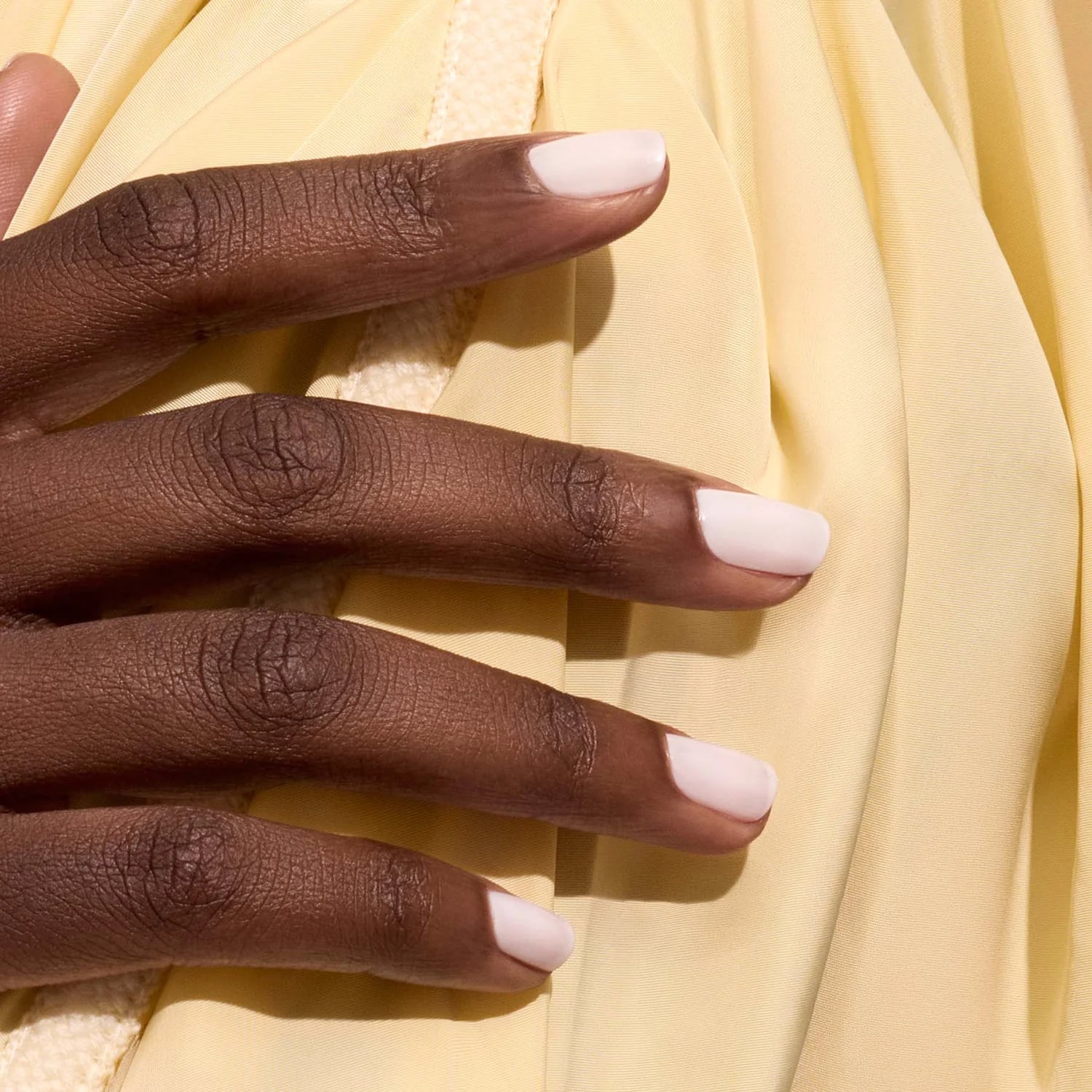 Milky White Short Almond on Yellow Fabric Milky White Short Almond on Yellow Fabric — Milky White Nails
