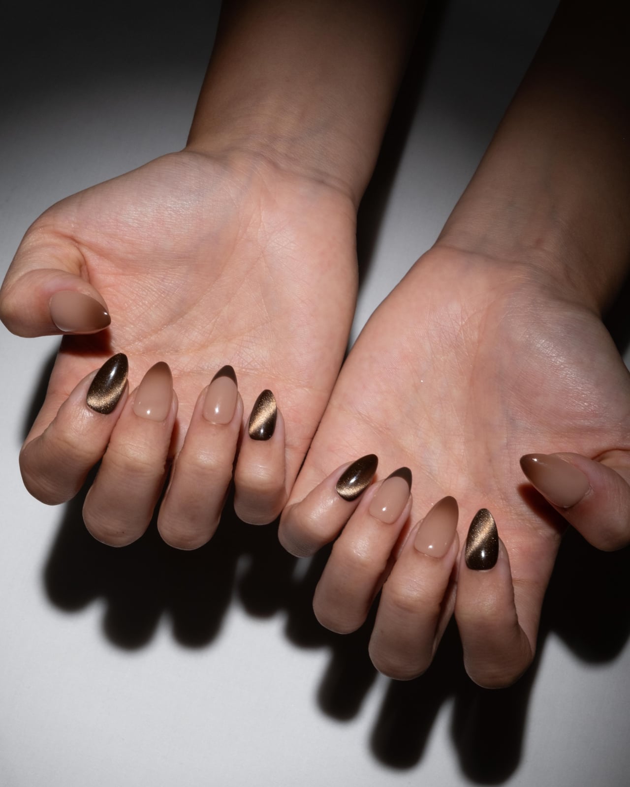 Nude Base Brown Cat-Eye French Medium Almond Nails, Close-Up Take — Mocha Nails