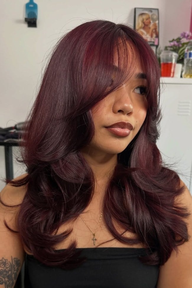 Glossy Mid-Back Blowout With Curtain Bangs — Mulled Wine Hair