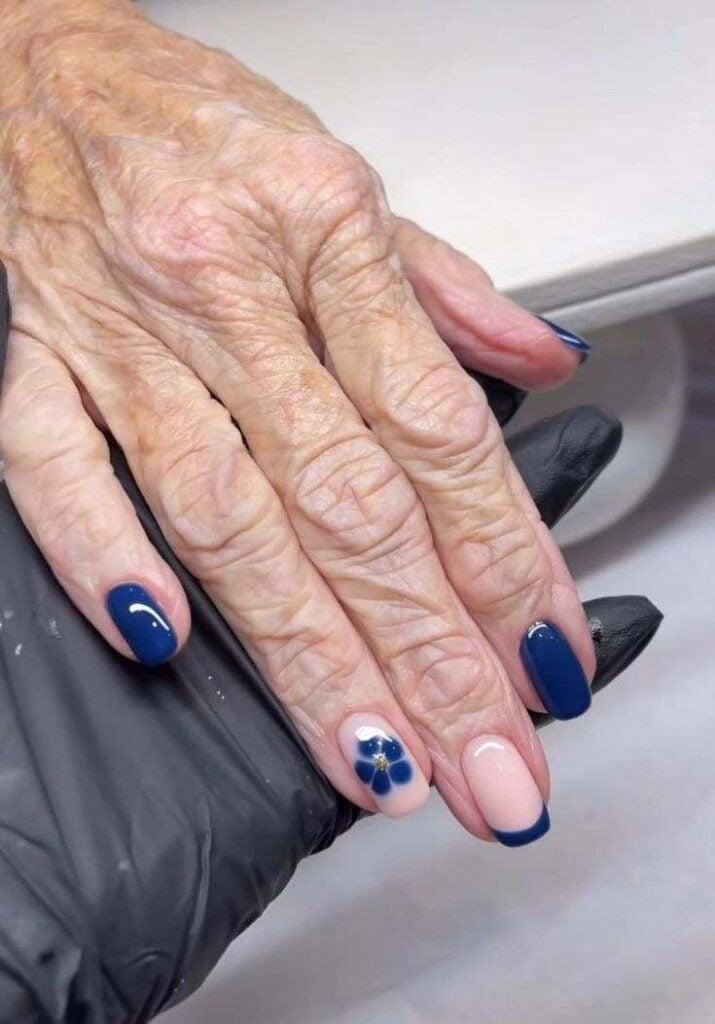 Navy French Tip with Floral Accent Oval Nails Navy French Tip with Floral Accent Oval Nails — Nails for Older Women